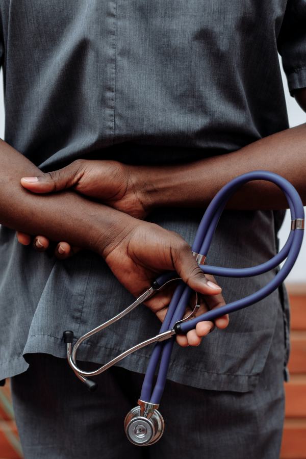 A person holding a pair of scissors in their hands.